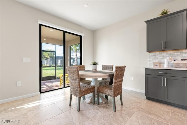 dining area featuring baseboards