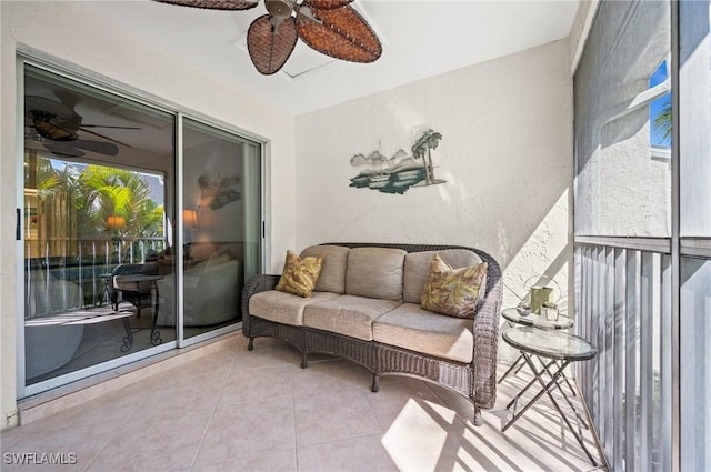 balcony with ceiling fan and an outdoor hangout area