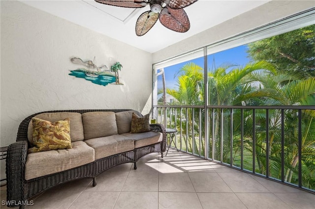 sunroom / solarium with a ceiling fan