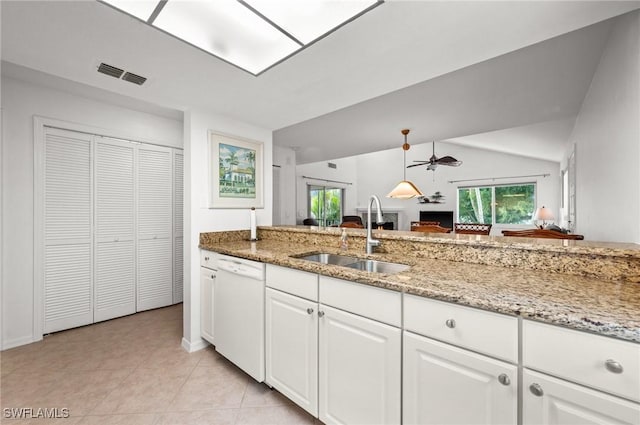 kitchen featuring visible vents, dishwasher, a sink, and white cabinetry