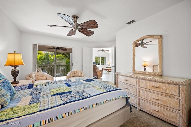 bedroom featuring a ceiling fan, visible vents, and access to exterior