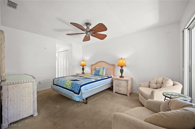 carpeted bedroom with a ceiling fan, a closet, visible vents, and baseboards