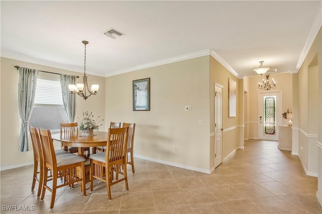 dining room featuring ornamental molding, a healthy amount of sunlight, visible vents, and a chandelier