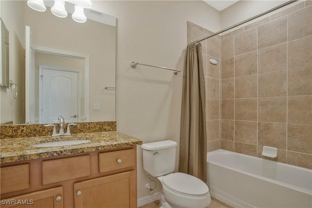 bathroom with vanity, toilet, and shower / bath combo