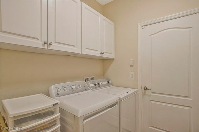 laundry area featuring cabinet space and washing machine and dryer