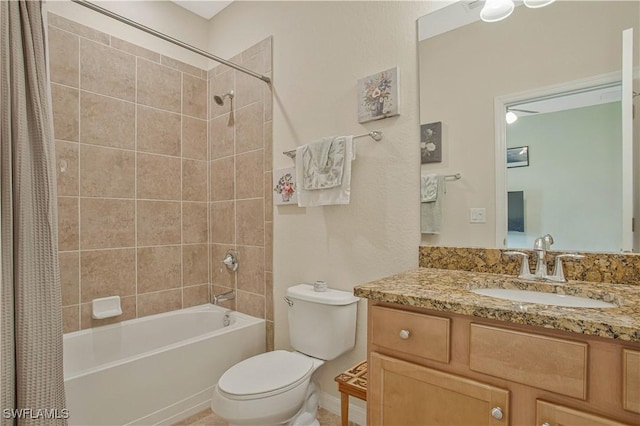 bathroom with vanity, toilet, and shower / tub combo