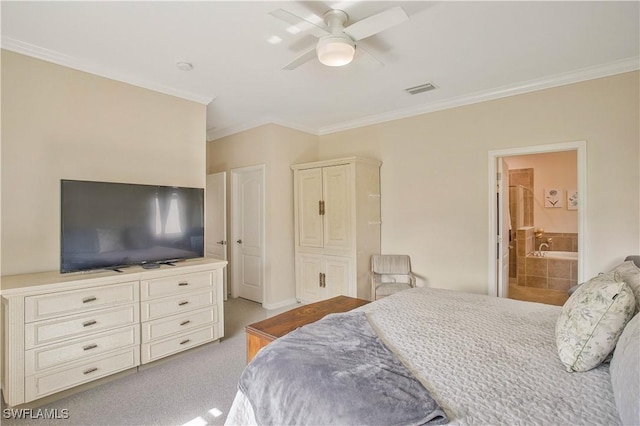 bedroom featuring ensuite bath, crown molding, light colored carpet, and ceiling fan