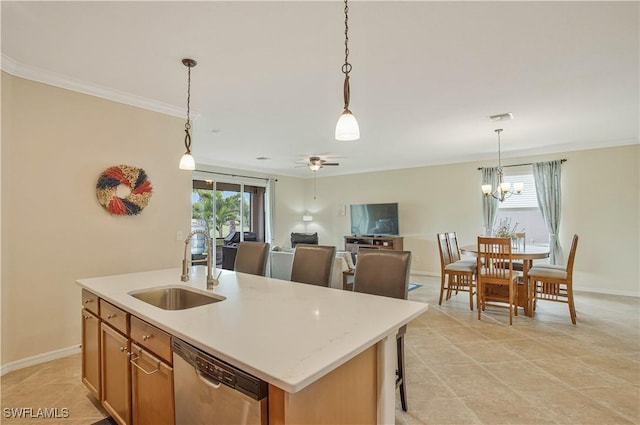 kitchen featuring pendant lighting, a sink, stainless steel dishwasher, crown molding, and light countertops