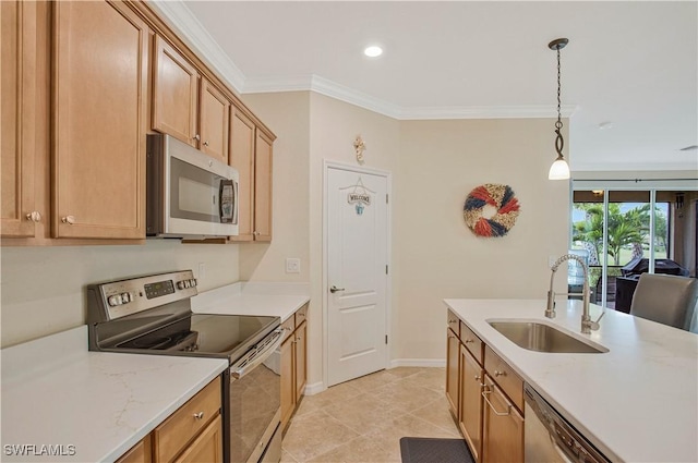 kitchen with crown molding, baseboards, hanging light fixtures, stainless steel appliances, and a sink