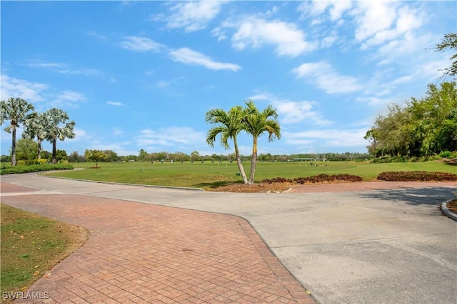 view of property's community with a lawn