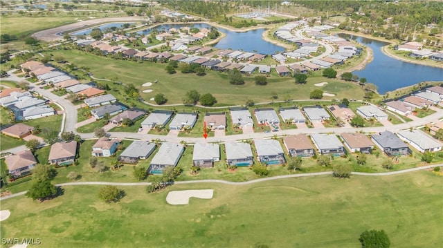 birds eye view of property with golf course view, a residential view, and a water view