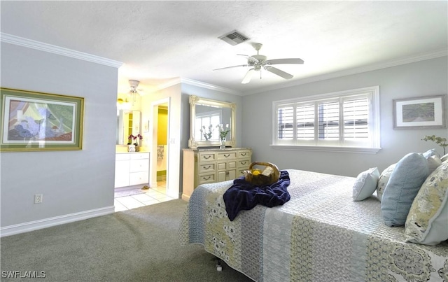 carpeted bedroom with crown molding, visible vents, ensuite bathroom, baseboards, and tile patterned floors