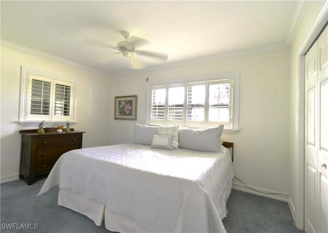 bedroom featuring baseboards, ceiling fan, ornamental molding, carpet floors, and a closet