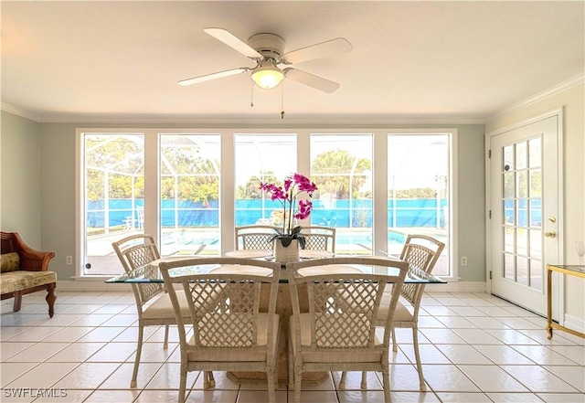 sunroom featuring ceiling fan