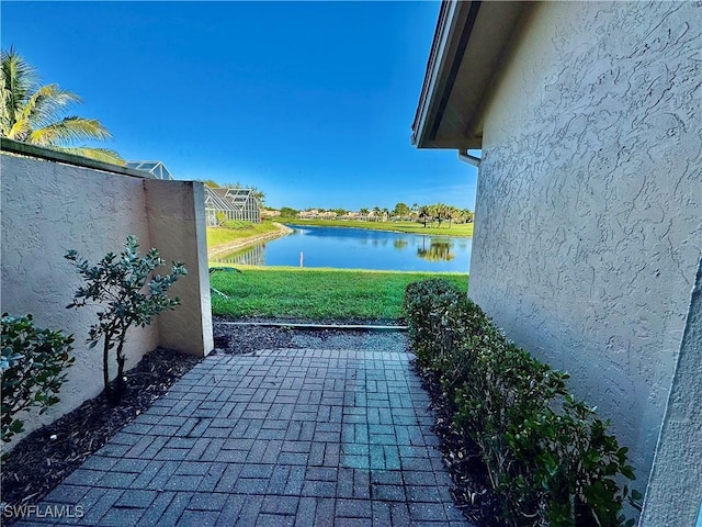 view of patio featuring a water view