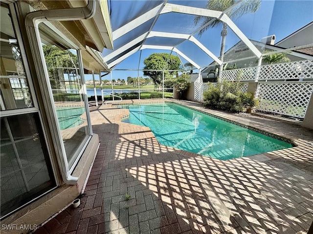 outdoor pool featuring a patio and a lanai