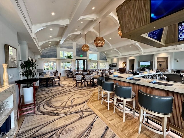 11730 Quail Village Way Unit 103-1, Naples, FL 34119 - bar featuring high vaulted ceiling, recessed lighting, and beamed ceiling