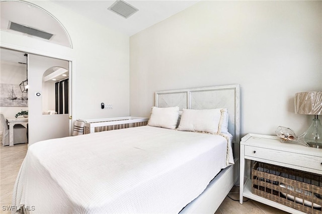 bedroom with visible vents and light tile patterned flooring