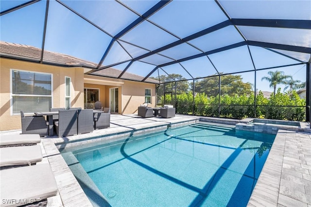 view of swimming pool with glass enclosure, an outdoor hangout area, a patio area, a pool with connected hot tub, and outdoor dining space