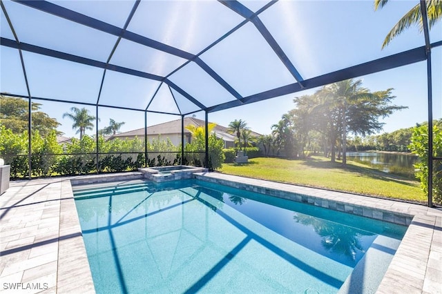 view of swimming pool featuring a lanai, a patio area, a pool with connected hot tub, and a yard