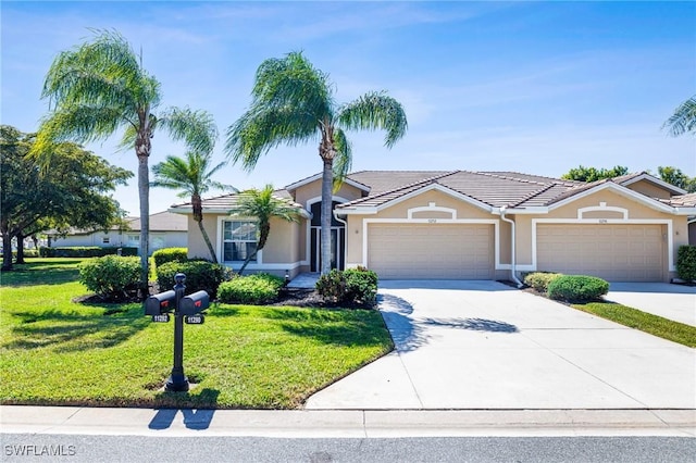 single story home featuring driveway, stucco siding, an attached garage, and a front yard