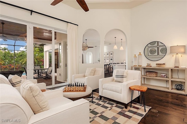 living room featuring hardwood / wood-style flooring and ceiling fan