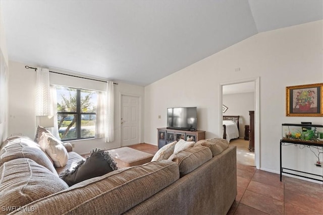 living room with tile patterned flooring and vaulted ceiling