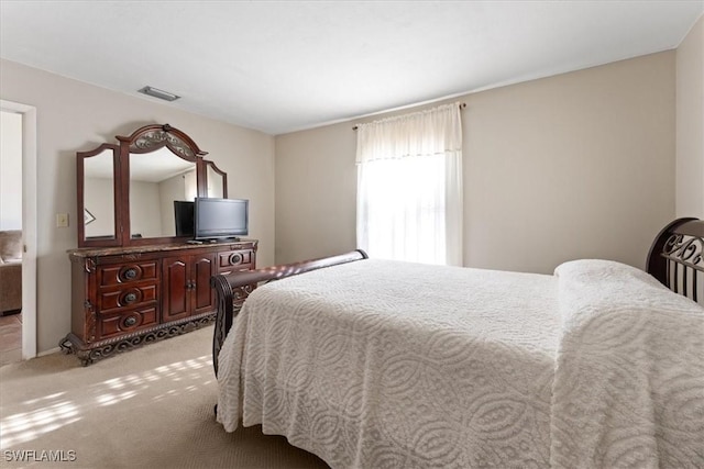 bedroom with carpet flooring and visible vents