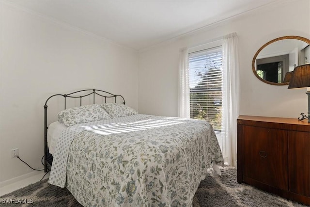 bedroom with carpet flooring and crown molding