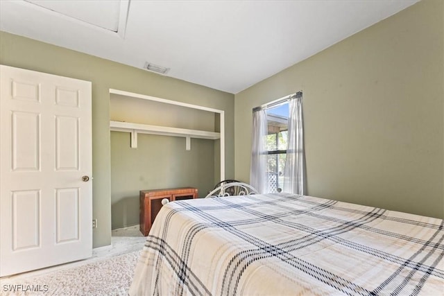 bedroom featuring visible vents and a closet