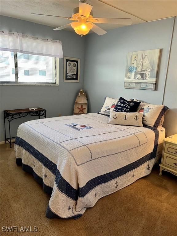 carpeted bedroom with ceiling fan