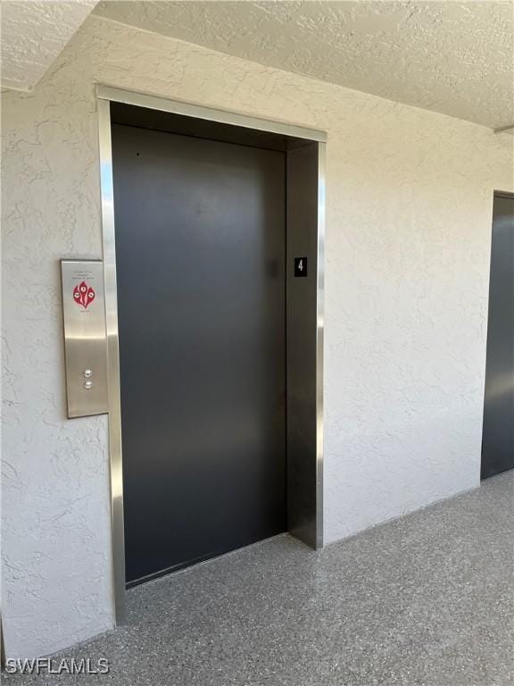 view of exterior entry with elevator