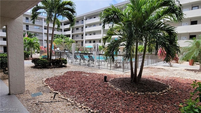 2121 Collier Ave Unit 405, Fort Myers, FL 33901 - view of community featuring fence and a pool