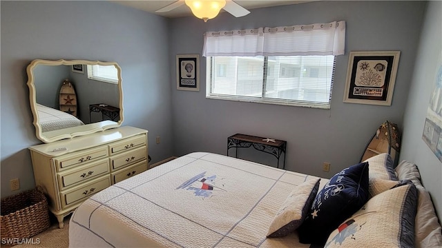 2121 Collier Ave Unit 405, Fort Myers, FL 33901 - bedroom with light colored carpet and a ceiling fan