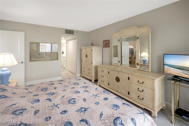 bedroom featuring visible vents and baseboards