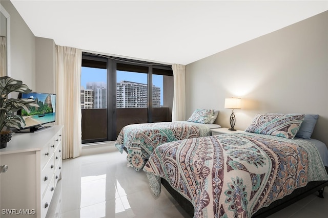 bedroom featuring access to exterior and light tile patterned floors