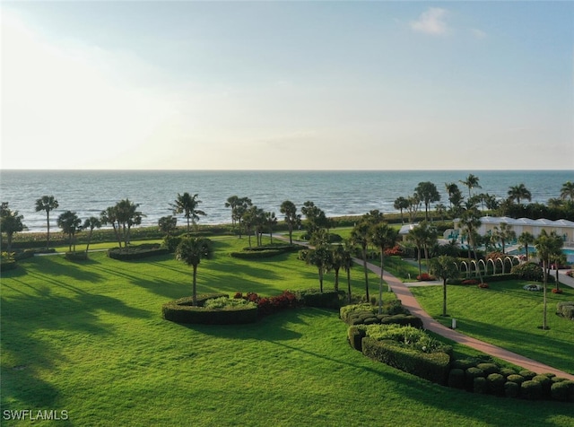 surrounding community featuring a yard and a water view