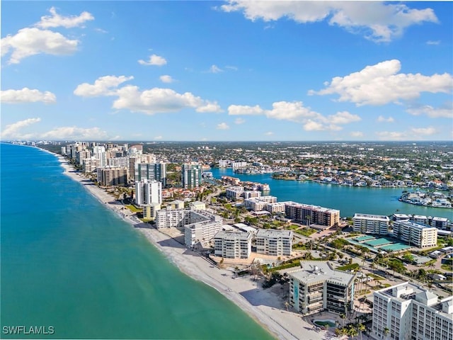 aerial view featuring a view of the beach, a view of city, and a water view