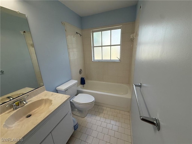 bathroom with tile patterned flooring, bathtub / shower combination, vanity, and toilet