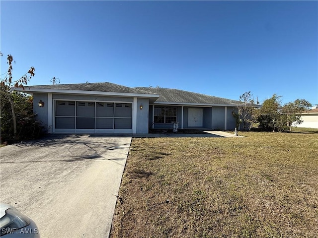 ranch-style home featuring a front yard, concrete driveway, an attached garage, and stucco siding