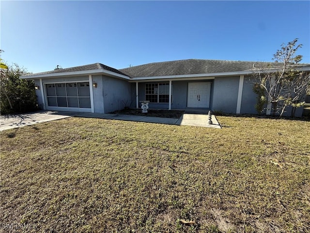 ranch-style home featuring a garage, driveway, a front yard, and stucco siding