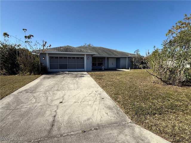 single story home with a front yard, driveway, an attached garage, and stucco siding