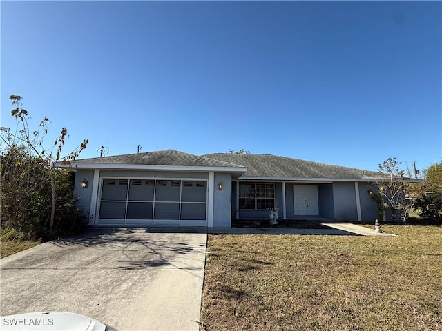 single story home with driveway, a front yard, an attached garage, and stucco siding