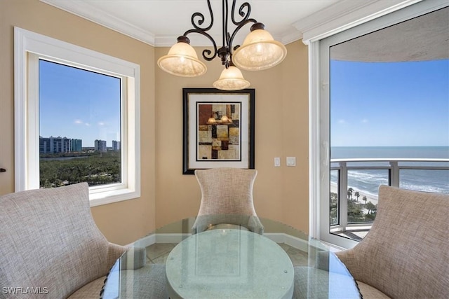 dining room with plenty of natural light, baseboards, and ornamental molding