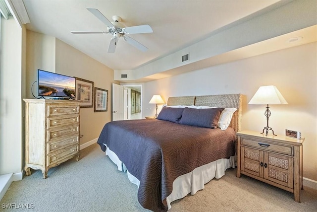 carpeted bedroom featuring visible vents, baseboards, lofted ceiling, and ceiling fan