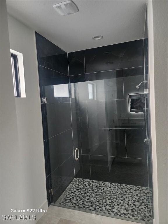 651 Knapp St, Lehigh Acres, FL 33974 - bathroom with a stall shower and visible vents