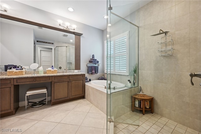 full bathroom with visible vents, a shower stall, a garden tub, tile patterned floors, and vanity