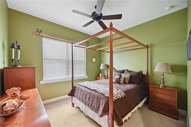 bedroom with baseboards, carpet floors, and a ceiling fan