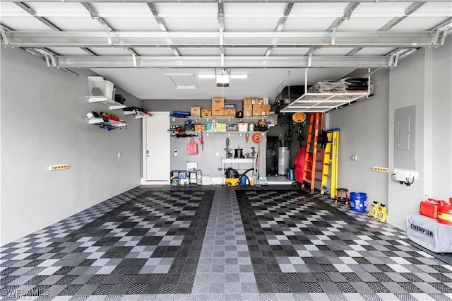 garage with electric panel, a garage door opener, and electric water heater