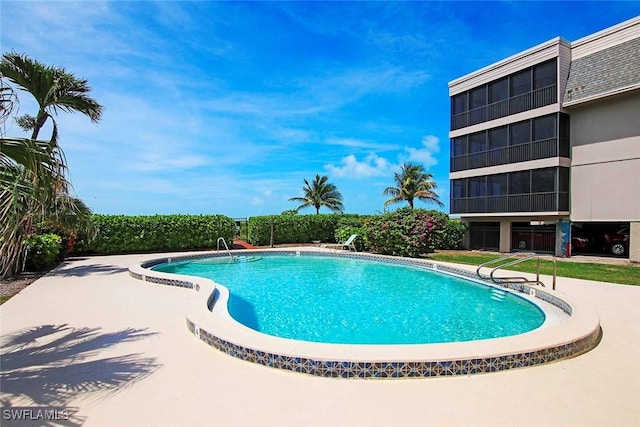 community pool with a patio